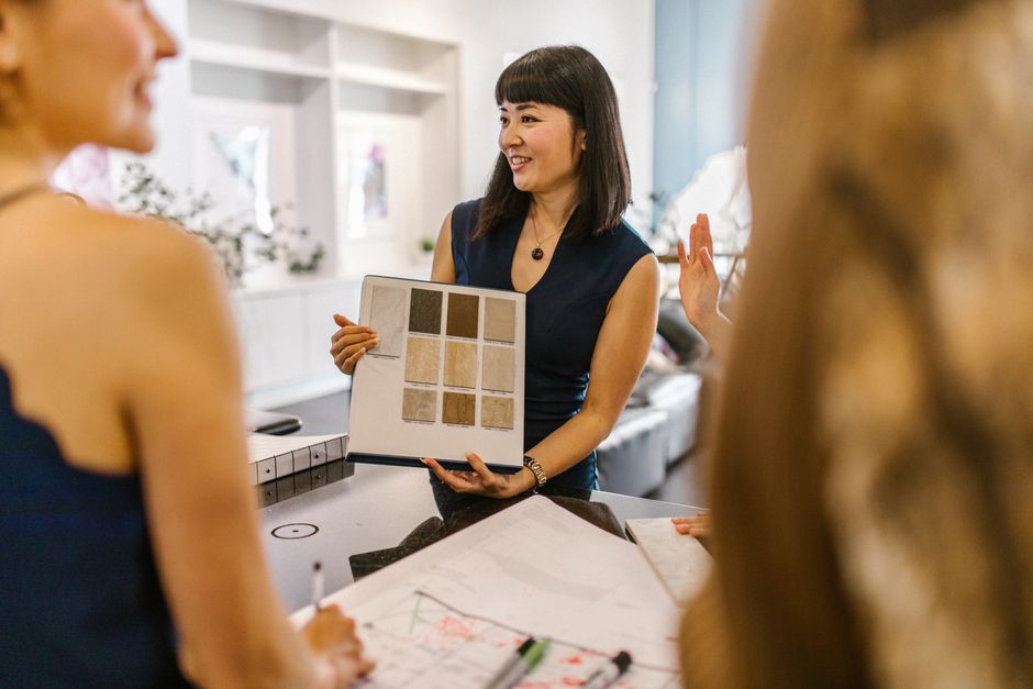 Professional interior designer organizing a wardrobe
