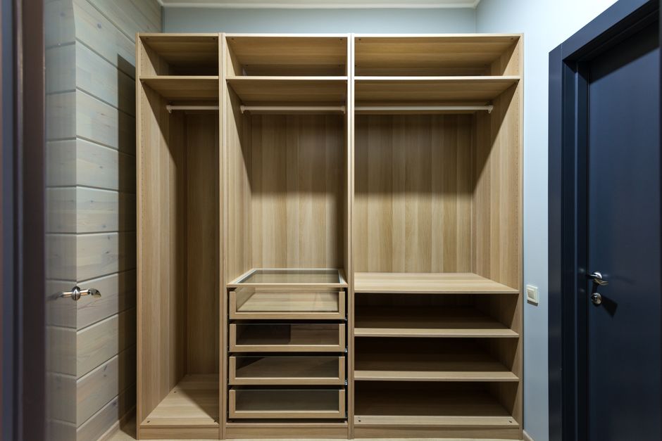 Wooden closet drawers and shelving