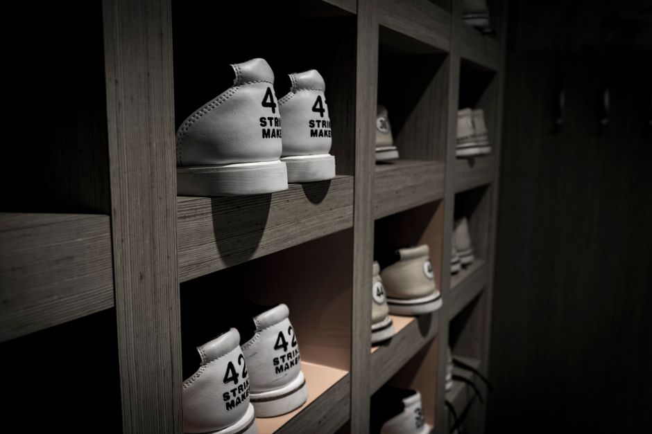 Large shoe collection displayed on custom shelves
